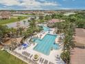 Resort-style pool with multiple pools, a spa, and a clubhouse at 2760 Rialto Ct, Kissimmee, FL 34746