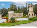 Gated community entrance with attractive landscaping at 2760 Rialto Ct, Kissimmee, FL 34746