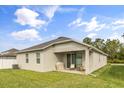 Backyard features a covered patio, great for outdoor entertaining at 1554 Outback W Rd, St Cloud, FL 34771