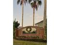 Brick entrance sign for Debbield Place, decorated for the holidays at 267 Doe Run Dr, Winter Garden, FL 34787