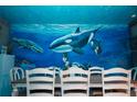 Dining room with white table and chairs, ocean mural at 2734 Oxymoron Way, Kissimmee, FL 34746