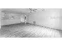 Bright and airy living room with gray vinyl plank flooring at 2810 E 21St St, Sanford, FL 32771