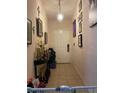 Entryway with tile flooring, chandelier, and storage space at 345 Reserve Dr, Davenport, FL 33896