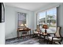 Bright office space with wood-look floors and large window at 6019 Live Oak Dr, Winter Haven, FL 33880