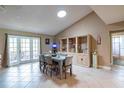 Bright dining room with a wooden table and access to a patio at 653 Pelican Bay Dr, Daytona Beach, FL 32119