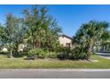 House exterior with lush landscaping at 1562 Anorada Blvd, Kissimmee, FL 34744