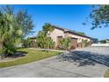 House exterior with driveway and garage at 1562 Anorada Blvd, Kissimmee, FL 34744