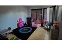 Fun playroom with a trampoline and various toys at 2546 Lemon Tree Ln # 4, Orlando, FL 32839