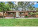 Ranch style brick home with a covered entryway at 702 Arthur St, Kissimmee, FL 34741