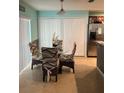 Small dining area with a glass table and four chairs at 1952 Dunn Cove Dr, Apopka, FL 32703