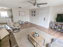 Living room with a large TV, comfortable seating, and hardwood flooring at 3053 George Mason Ave # D, Winter Park, FL 32792