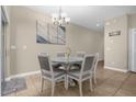 Dining area with round table and gray chairs at 8962 Cuban Palm Rd, Kissimmee, FL 34747