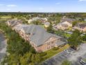 Aerial view of community, showcasing building and landscaping at 14304 Fredricksburg Dr # 420, Orlando, FL 32837