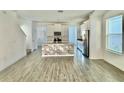 Open concept kitchen with island and stainless appliances at 1652 Cross Prairie Pkwy, Kissimmee, FL 34744