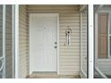 White front door with a welcome sign at 2788 Privada Dr, The Villages, FL 32162
