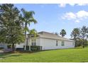 One-story house with a large backyard and palm trees at 2871 Sandy Cay St, Clermont, FL 34711