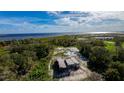 Aerial view of a house under construction with waterfront access at 71 E Lake Shore Blvd, Kissimmee, FL 34744
