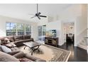 Spacious living room with high ceilings, large windows, and views of the dining area at 2815 Crane Trace Cir, Orlando, FL 32837