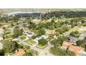 Wide aerial view of the house and surrounding neighborhood at 5646 Masters Blvd, Orlando, FL 32819