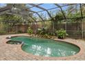 Screened pool and spa with brick pavers at 9792 Wild Oak Dr, Windermere, FL 34786