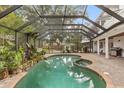 Relaxing screened pool and spa area at 9792 Wild Oak Dr, Windermere, FL 34786