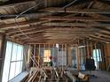 Under construction interior, showing exposed beams and framing at 384 Magnolia Pl, Debary, FL 32713