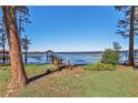 Wooden dock and gazebo offer serene lake access at 10121 Lone Tree Ln, Orlando, FL 32836