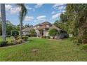 House exterior with fountain and landscaping at 36 Allenwood Look, Ormond Beach, FL 32174
