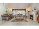 Elegant living room with fireplace and seating area at 36 Allenwood Look, Ormond Beach, FL 32174