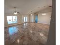 Spacious living room with tile flooring and high ceilings at 8749 Se 159Th Ln, Summerfield, FL 34491