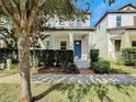 Two story house with front porch and manicured hedges at 9344 Tyrella Pine Trl, Winter Garden, FL 34787