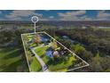 Aerial view of property showing house, pond, and grounds at 4150 Citrus St, Kissimmee, FL 34746