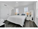 Spacious bedroom with king-size bed and dark hardwood floors at 770 Siena Palm Dr # 305, Celebration, FL 34747