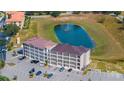 Aerial view of building and pond at 831 Retreat Blvd # 402, Davenport, FL 33897