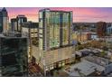 High rise building at dusk, in a city setting at 155 S Court Ave # 1912, Orlando, FL 32801