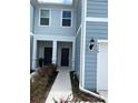 Front entry of townhouse with walkway and landscaping at 4778 Sparkling Shell Ave, Kissimmee, FL 34746