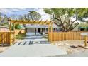 Cute cottage with a pergola and wooden fence at 280 Westwood Ave, Winter Haven, FL 33880
