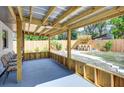 Covered patio with seating area and outdoor bar at 280 Westwood Ave, Winter Haven, FL 33880