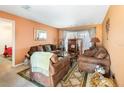 Living room with brown couches and a coffee table at 4963 Neponset Ave, Orlando, FL 32808