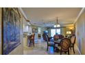 Bright living room with comfortable seating, dining area, and partial kitchen view at 5300 S Atlantic Ave # 2-502, New Smyrna Beach, FL 32169