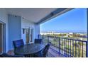 Spacious balcony with outdoor furniture and partial ocean view at 5300 S Atlantic Ave # 2-502, New Smyrna Beach, FL 32169