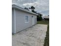 View of the detached structure and concrete patio at 603 Maggie Cir, Winter Haven, FL 33880