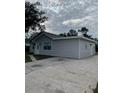 Another view of the house showing a detached structure at 603 Maggie Cir, Winter Haven, FL 33880