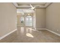 Bright and airy living room with tile floors and high ceilings at 8681 Crested Eagle Pl, Sanford, FL 32771