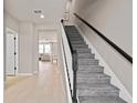 Elegant staircase leading to upper level of home at 10274 Hadley St, Orlando, FL 32829