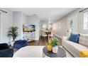Open concept living and dining area with hardwood floors and modern furniture at 1062 Reams St, Longwood, FL 32750