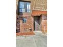 Brick building exterior with a brown door and walkway at 1836 N Crystal Lake Dr # 31, Lakeland, FL 33801
