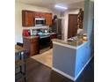 Modern kitchen with stainless steel appliances and granite countertops at 2030 Cascades Blvd # 302, Kissimmee, FL 34741