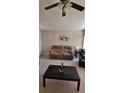 Living room with a brown recliner and coffee table at 2314 Carriage Run Rd, Kissimmee, FL 34741