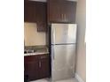 Stainless steel refrigerator in updated kitchen at 2802 N Powers Dr # 18, Orlando, FL 32818